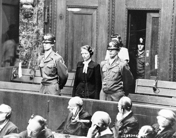 Nuremberg defendant, Dr. Herta Oberheuser, stands to receive her sentence at the Doctors’ Trial. Photo by anonymous (20 August 1947). United States Holocaust Memorial Museum Photo #41017. PD-U.S. Government. Wikimedia Commons. 