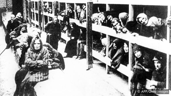 Women in the barracks at Auschwitz after the camp’s liberation. Photo by anonymous (c. April 1945). AFP/Getty Images.