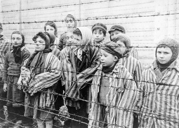 Child survivors of Auschwitz. Photo by Soviet army photography unit (c. 1945). United States Holocaust Memorial Museum, courtesy of Belarussian State Archive of Documentary Film and Photography. PD-Author release. Wikimedia Commons.