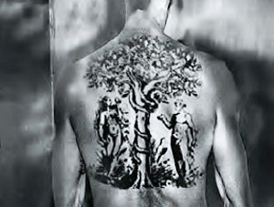 Adam and Eve tattoo on the back of a prisoner. Half an hour after taking this photo, Brasse saw the dead inmate and he had been skinned for the tattoo. The skin was stretched on a table waiting to be framed for one of the Auschwitz doctors. Photo by Wilhelm Brasse (c. 1940-45). Nowa Historia.