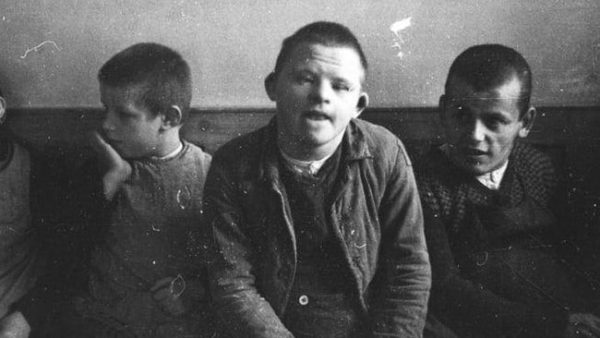 Several boys with Down syndrome being held at “Aktion T4” site Heilanstalt. They would be killed shortly. Photo by anonymous (date unknown).