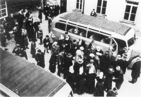 Relocation of the disabled as part of the euthanasia “Aktion T4” from the Schloß Bruckberg nursing home of the Neuendettelsau deaconess center to state sanatoriums and nursing homes. Photo by anonymous (c. April 1941). PD-Author’s life plus 70 years or fewer. Wikimedia Commons.