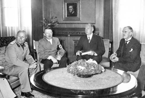 Munich conference. Left to right: Mussolini, Hitler, Schmidt (translator), and Chamberlain. Photo by anonymous (29 September 1939). Bundesarchiv, Bild 146-1970-052-24/CC-BY-SA 3.0. PD-CCA-Share Alike 3.0 Germany. Wikimedia Commons.