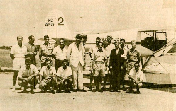 The Duke of Windsor (in dark suit) visiting the Bermuda Flying School on his way to becoming the governor of the Bahamas. Photo by the RAF (c. 1940). PD-U.K. Government. Wikimedia Commons.