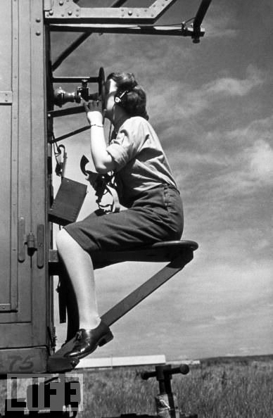 Reporting the position of enemy aircraft to gun crews. Photo by anonymous (date unknown). PD-Expired copyright.