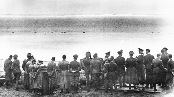 Göring (sixth from the right) and other German officers look out across the English Channel toward Dover, England. It was as close to England as they ever got. Photo by anonymous (1 July 1940). The National WWII Museum. www.nww2m.com.