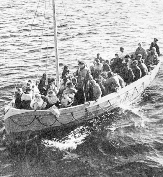 After being adrift eight days in the rough Atlantic, survivors of the sinking of the SS City of Benares are finally rescued by the British destroyer, HMS Anthony. This lifeboat includes five children. Photo by anonymous (c. September 1940).