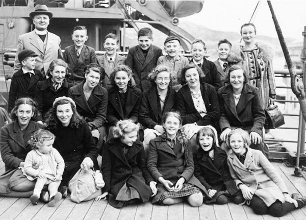 Group of children aboard an evacuation ship bound for New Zealand. Photo by anonymous (c. 1940). National Archives UK. PD-No known copyright restrictions. Wikimedia Commons. 