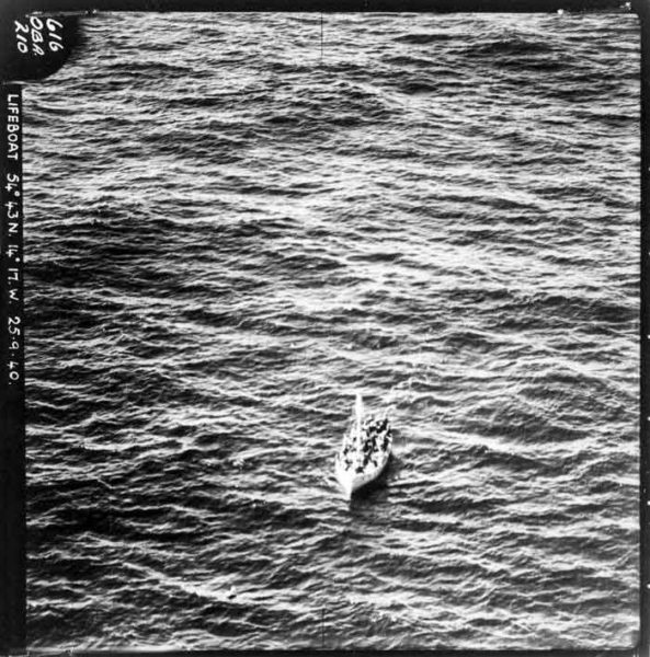 Aerial photograph of a Benares lifeboat waiting to be rescued. It is likely this is the lifeboat that was rescued by the HMS Anthony. Photo by anonymous (25 September 1940). The National Archives. PD-No known copyright restrictions. Wikimedia Commons. 