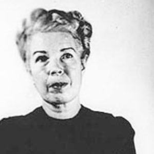 Mugshot of Mildred Gillars (née Sisk), a.k.a. “Axis Sally.” Photo by anonymous (date unknown). PD-U.S. Government. Wikimedia Commons.