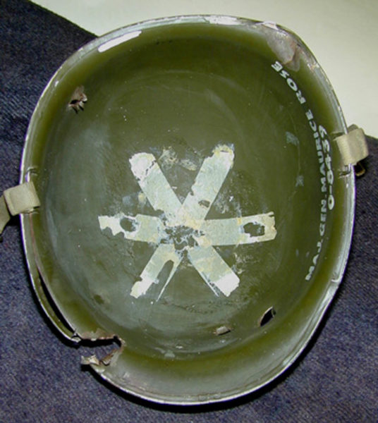 Interior of the helmet worn by MG Maurice Rose when he was shot and killed on 30 March 1945. The bullets that struck Rose’s helmet did not kill him. The helmet flew off his head before he was struck by the third (of four) bursts from a 9mm “Schmeisser” automatic pistol. The first burst hit the general in the right cheek and knocked the helmet off his head. Photo by Charles Lemons (date unknown). The Patton Museum.