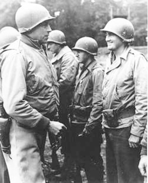 MG Maurice Rose awards the Bronze Star with cluster to Lt. Col. Carlton Russell in Stolberg, Germany. Photo by anonymous (3 October 1944). 