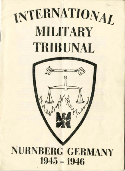 International Military Tribunal (IMT) booklet cover. Printed for those in attendance at the IMT. Photo by anonymous (date unknown). Courtesy of United States Holocaust Memorial Museum. Gift of Lise McCartney.