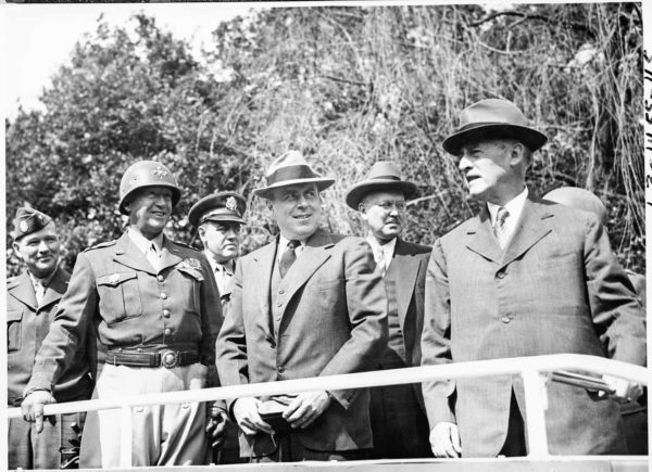Reviewing stand for the 2nd Armored Division in Berlin. Left to right: Maj. Gen. Floyd Parks, Gen. George S. Patton, Col. W.H. Kyle, Assistant Secretary of War, John J. McCloy, and Secretary of War, Henry Stimson. Photo by anonymous (20 July 1945). U.S. National Archives and Records Administration. PD-U.S. Government. Wikimedia Commons.