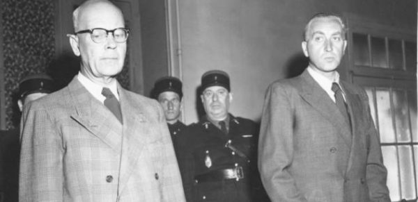 Karl Oberg (left) and Helmut Knochen (right) at their trial in September 1954. Each was sentenced to death but pardoned in 1963 and released. Photo by anonymous (c. 1954). 