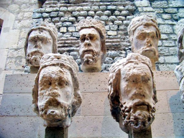 Five of the twenty-eight heads of the statues of the Kings of Judah decapitated during the French Revolution. Photo by Larry (May 2012). Musée de Cluny. PD-CCA 2.0 Generic. Wikimedia Commons.