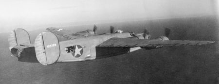 B-24D, “Hot Stuff” (tail no. 41-23728), in flight on her third mission off the coast of France. Photo by anonymous (c. 1942). PD-U.S. Government (USAAF). Wikimedia Commons.