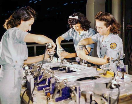 Women working on a fuselage component for the B-24 at Consolidated Aircraft. Photo by Howard R. Hollem (c. October 1942). PD-U.S. Government. Wikimedia Commons.