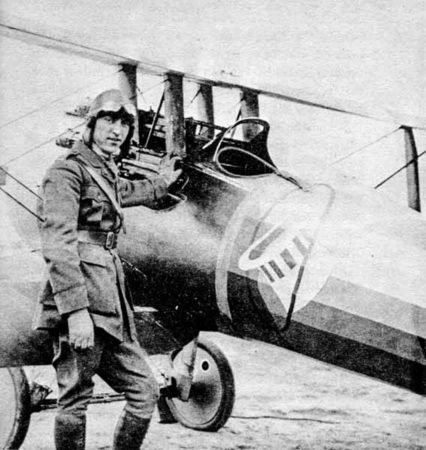 World War I ace, Eddie Rickenbacker, next to his Nieuport 28 with the nose art “Hat in the Ring.” Photo by anonymous (date unknown). Rosebud’s WWI Early Aviation Image Archive. PD-Author’s life plus 70-years or fewer. Wikimedia Commons.
