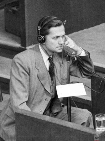 Former SS-Brigadeführer and head of foreign intelligence, Walter Schellenberg, is seen in the witness box during the Nuremberg trial giving evidence. Photo by Eddie Worth (4 January 1946). Associated Press.