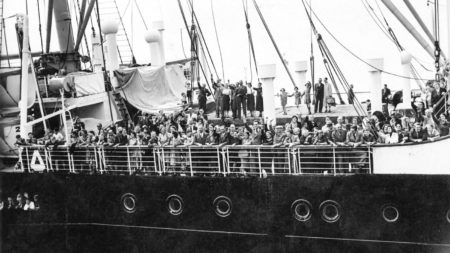 Refugees aboard the M.S. St. Louis. Arriving in Antwerp, Belgium, they had been denied entry to the United States and Cuba. Most its 937 passengers were Jewish and many did not survive the war. Photo by anonymous (date unknown). Three Lions/Hulton Archive/Getty Images.