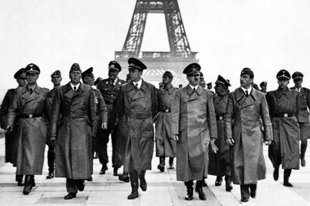 Adolf Hitler and his entourage at the Trocodéro with the Eiffel Tower in the background. Photo by Heinrich Hoffman (23 June 1940). German Federal Archives. PD-Bundesarchiv, Bild 183-H28708/CC BY-SA 3.0 DE. Wikimedia Commons.