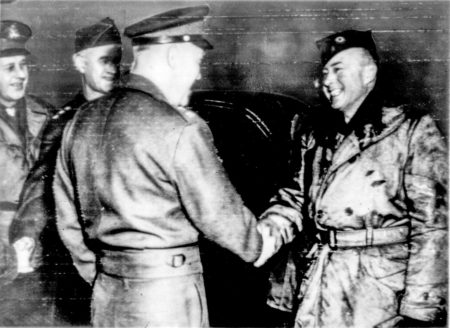 Gen. Eisenhower shakes hands with William Bullitt. The former ambassador applied for duty in the U.S. military services but was denied. He then joined the French army where he met Eisenhower, Lt. Gen. Devers (far left) and Lt. Gen. Omar Bradley (second from left) in France. Photo by anonymous (2 December 1944). Author’s collection.