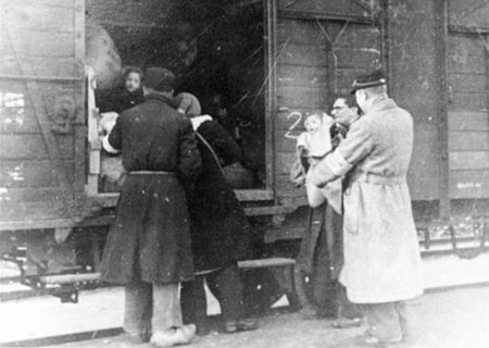 Deportation of citizens from the Westerbork transit camp in the Netherlands. The train was destined for one of four extermination camps including Auschwitz. Photo by Rudolf Preslauer (c. 1944). PD-Author’s life plus 70 years or fewer. Wikimedia Commons.