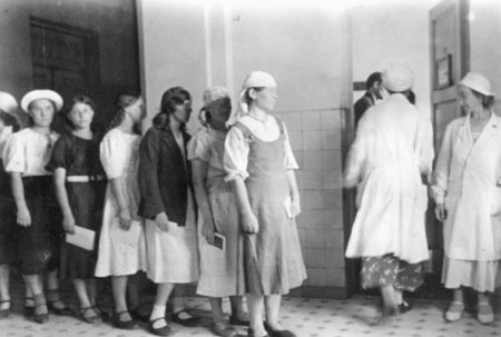 Medical checkup before departure to unknown German slave markets: already pregnant foreigners were not allowed entry into Germany. Photo by Knödler (c. May 1942). Bundesarchiv, Bild 183-B19880.