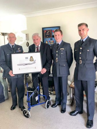 Officers from 10 Squadron RAF Brize Norton presenting Stanley with a signed photograph of a Voyager aircraft. Photo by Louise Smith (26 April 2022). Courtesy of Pat Vinycomb.