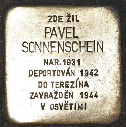 Memorial bronze plate, known as a “Stolperstein,” is inscribed with the names of victims of extermination or persecution by the Nazis. This Stolperstein is dedicated to Pavel Sonnenschein. Photo by anonymous (date unknown).