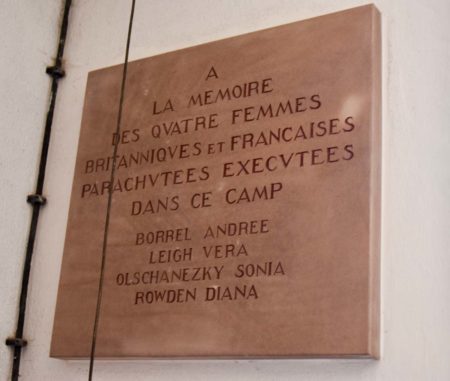 Memorial plaque to the four SOE women agents murdered at Natzweiler-Struthof on 6 July 1944. The plaque is located next to the crematorium oven. Photo by Sandy Ross (6 June 2022).