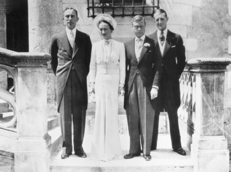 The Duke and Duchess of Windsor (center) pose with Herman Rogers (left), who gave the bride away, and best man, Major Fruity Metcalf (right). The wedding party is standing on the front steps of the Château de Candé. Photo by anonymous (c. June 1937).