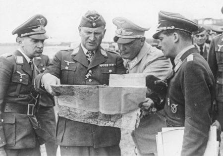 Left to right: Chief of General Staff of the Luftwaffe General Hans Jeschonnek, Lieutenant General Bruno Loerzer, and Reichsmarschall Hermann Göring studying a map during the Battle of Britain. Photo by anonymous (c. 1940). Via.