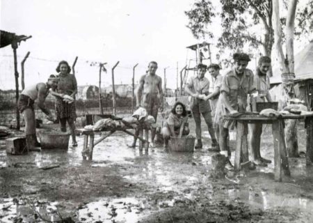 Jewish men and women washing their clothing on laundry day at British detention camp no. 60 in Cyprus. Photo by anonymous (date unknown). https://archives.jdc.org. 