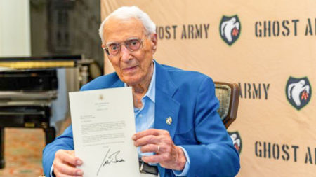 George Dramis, 97, receives a Congressional Gold Medal to the Ghost Army. Dramis is one of nine living former soldiers who served in the Ghost Army. Photo by WRAL News (25 July 2022). ©️CBS. 