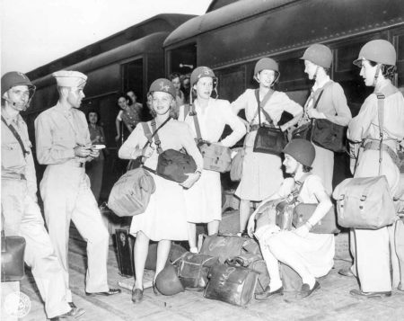War correspondents and personnel of the Office of Strategic Services, including Virginia Stuart (fourth from left), leaving from Camp Patrick Henry, in Virginia, to go overseas. Photo by anonymous (c. July 1944). National Archives. Photo no. 336-H-17-E8671.