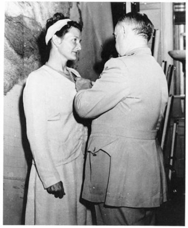 Virginia Hall receiving the Distinguished Service Cross from Gen. William “Wild Bill” Donovan. Photo by anonymous (c. September 1945). PD-U.S. government. Wikipedia Commons.