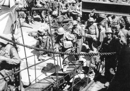 Reportedly, the soldier on the gangplank to the right is Pfc. Weiss embarking on a British landing craft near Naples. Photo by anonymous (c. August 1944). Courtesy of U.S. Army Intelligence Center of Excellence. https://www.military.com.