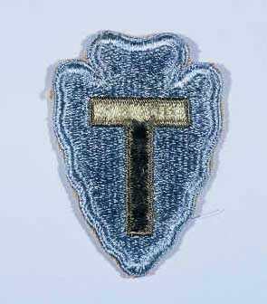 Insignia of the 36th Infantry Division. The “T” represents Texas and the arrowhead, Oklahoma. Photo by anonymous (date unknown). United States Holocaust Memorial Museum – Collections.