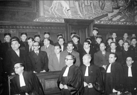 The trial of the French Gestapo, the Bonny-Lafont gang. Henri Lafont (front row left), Pierre Bonny (front row, second from left), Alexandre Villaplane (front row, sixth from left), and five others were convicted and executed by firing squad on 26 December 1944 at Fort de Montrouge outside Paris. Photo by anonymous (c. December 1944).