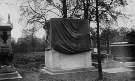 Oscar Wilde’s monument tomb after it was covered in a tarp. The sculpture was scandalous due to prominent display of male genitals. Photo by Henri Roger-Viollet (c. 1912). 