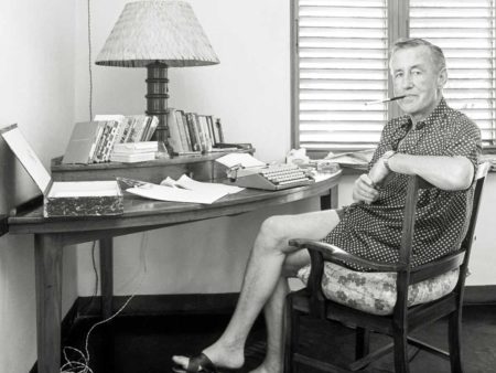 Ian Fleming at his desk at GoldenEye in Oracabess Bay, Jamaica. Photo by anonymous (date unknown).