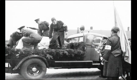 Erik Ringman’s coffin on the bed of the transport vehicle upon his return home. Photo by anonymous (c. April 1945). https://remember.org.