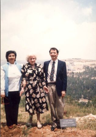 Bernard Kempler (right) and Ziuta (center) at Yad Vashem for the dedication of a tree planted in honor of Rozalia Natkaniec. Ziuta was the only surviving member of her family and as a child, Rozalia successfully hid her for two years from the Germans. On 2 May 1985, Yad Vashem recognized Rozalia as “Righteous Among the Nations.” Photo by anonymous (date unknown). 