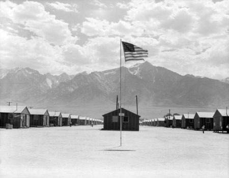 Manzanar relocation center, Manzanar, California. Street scene of barrack homes. Photo by Dorothea Lange (3 July 1942). National Archives at College Park. PD-U.S. Government. Wikimedia Commons.