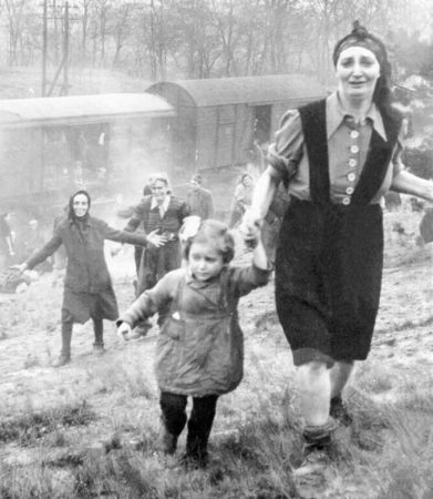 A 35-year-old Jewish woman from the Hungarian town of Makó and her 5-year-old daughter are liberated near the German village of Farsleben from a train taking KZ Bergen-Belsen inmates to another camp further east. Photo by Clarence L. Benjamin (c. April 1945). PD-U.S. Government. Wikimedia Commons.