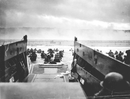 U.S. Army First Division troops disembarking from the LST (USS Samuel Chase) onto Omaha Beach on the morning of 6 June 1944. 