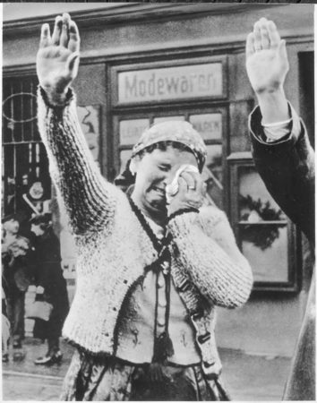The tragedy of this Sudeten woman, unable to conceal her misery as she dutifully salutes the triumphant Hitler, is the tragedy of the silent millions who have been “won over” to Hitlerism by the “everlasting use” of ruthless force. 