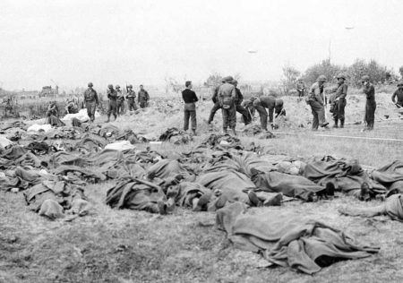 Remains of American soldiers killed on D-Day gathered in a field, Normandy, France. 